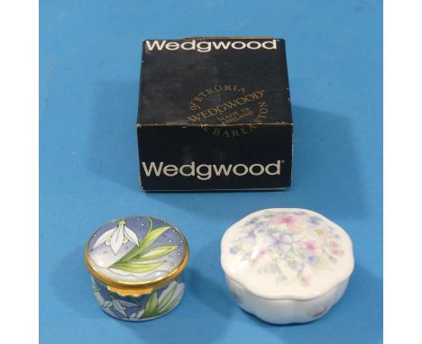 A Moorcroft Enamel circular Box, with snowdrop design, together with a boxed Wedgwood 'Angela' pattern Trinket Box (2) 
