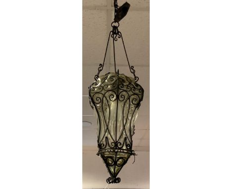 A 20th century Venetian style iron and smoke glass lantern light fitting, scrolling block bar ironwork frame, smoke grey glas