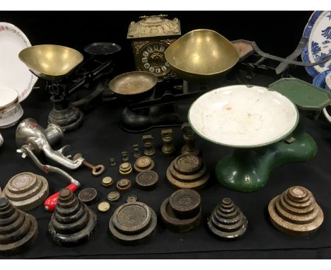 A set of Librasco counterbalance kitchen scales; three others including Salter, weights; a hand mincer; a cast metal bracket 