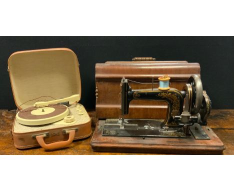 A late 19th century Gebr Nothmann no1 hand operate sewing machine; a 1960`s EMI portable record player, 45 rpm (2) 