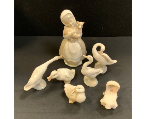 A Lladro goose, printed mark;   others;  a Nao figure of a girl, with a lamb;  etc 