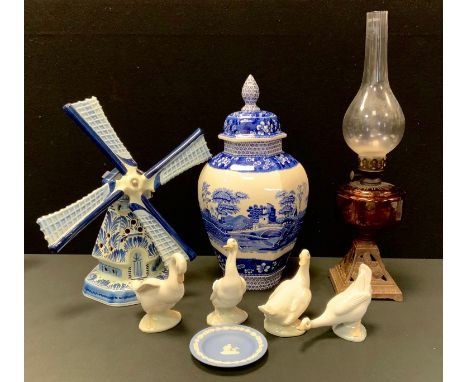 A large Spode blue tower pattern urn and cover, set four Nao ducks; blue and white Windmill; a Victorian cast iron and glass 