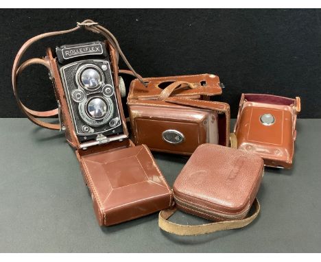 A Rolleiflex TLR 3.5B camera, produced 1954-1956, serial No 1491684, leather case, two filters, spare case etc 
