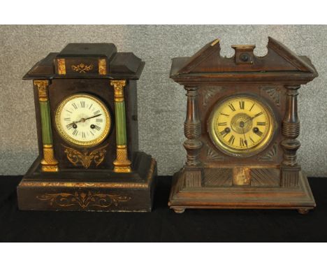 A 19th century slate mantle clock, together with a an early 20th century carved beech mantle clock raised on bun feet.H.37 x 