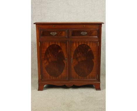 A contemporary Regency style twin door entertainment cabinet complete with with turntable, amp, speaker etc. H.86 W.82 D.45cm