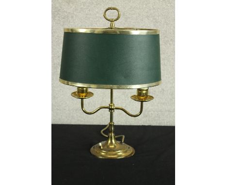 A mid century brass twin branch lamp raised on stepped circular base, complete with green shade. H.43cm. 