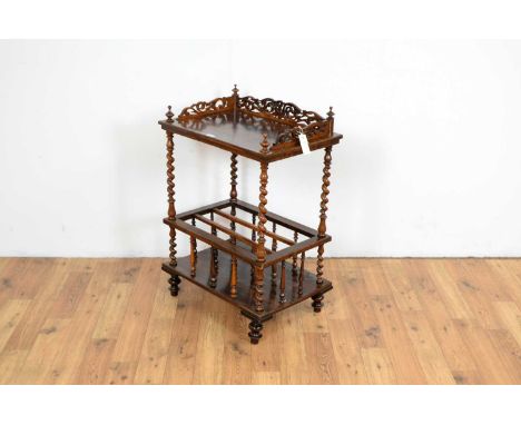 A Victorian rosewood canterbury, with pierced three quarter gallery to the top shelf, with barley twist supports, over a thre