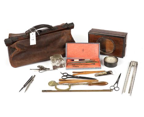 A 19th Century leather Gladstone bag; together with a selection of tools and equipment, including: a folding scout knife; a b