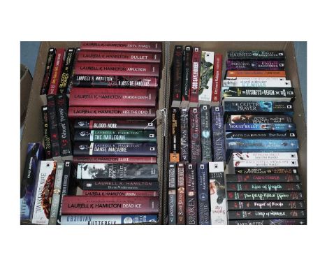 A selection of supernatural sci fi books, authors including: Laurell K. Hamilton; Patricia Briggs; Kelley Armstrong; Rachel C