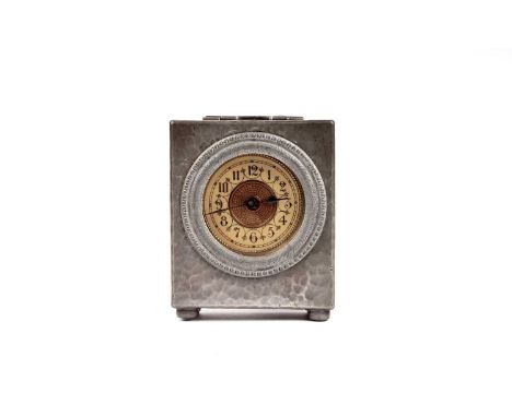 An English Pewter miniature pewter mantle clock, by Liberty &amp; Co, the cream Arabic dial with beaded gilt border, in hamme