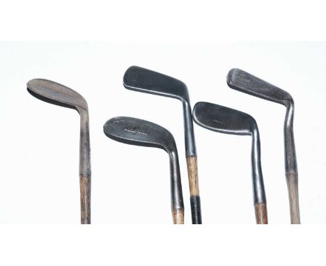 A selection of hickory shafted vintage golf clubs, including: a Maxwell model Niblick; a Corona Niblick; and others. (5)