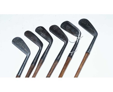A selection of hickory shafted vintage golf clubs, including: a Maxwell Model Goose Neck putter, by the St Andrews Golf Co Lt