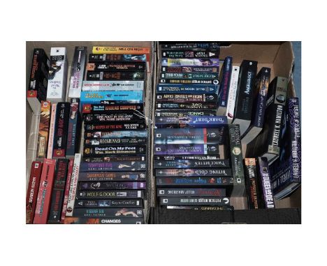 A selection of supernatural sci fi books, authors including: Laurell K. Hamilton; Keri Arthur; Kim Harrison; and others, cont