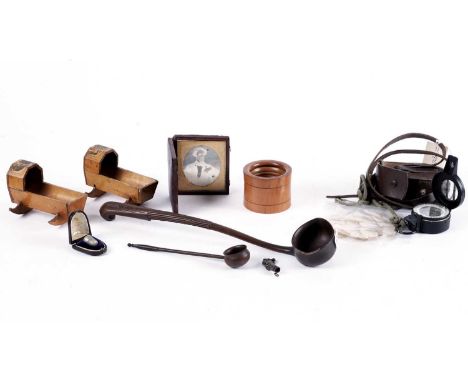 A selection of collectibles, including: a treen turned and carved fruitwood ladle; two Mauchlineware treen miniature rocking 
