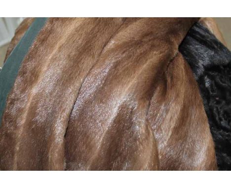 TWO VINTAGE FUR COATS
including a black three-quarter length and a brown knee-length example, approximately UK Ladies Size 10