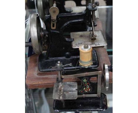 TWO VINTAGE MODEL SEWING MACHINES
larger 18cm long