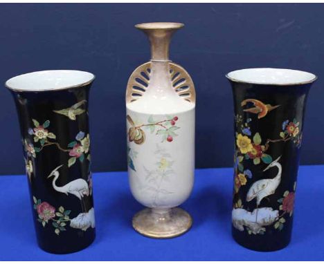 PAIR OF CARLTON WARE 'CLOISONNE' VASES
of cylindrical form, decorated with storks and stylised foliate on a black ground, wit