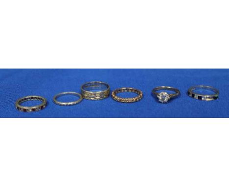 GROUP OF SIX RINGS
including a 9ct and paste band, an unmarked ruby eternity ring, a wedding band marked "PLAT", a 9ct weddin