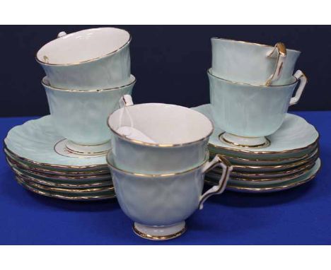 AYNSLEY TEA SERVICE
comprising six cups, six saucers, and six side plates, each decorated with rose motifs on a powder blue g