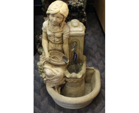 GARDEN WATER FEATURE
modelled as a girl seating on a stone basin, pump within, was in working condition when it was removed f