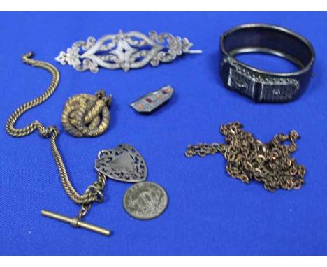 WHITE METAL SCROLLING BROOCH
together with a white metal bangle, two brass albert chains, a pinchbeck brooch etc.