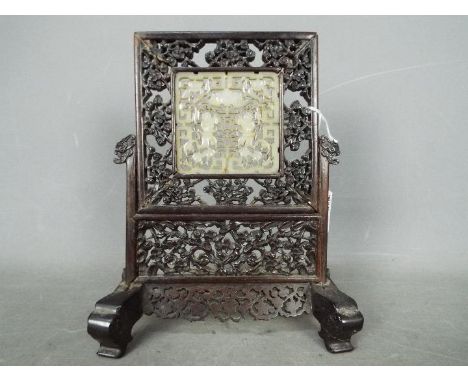 A carved wood and jade table screen, the inset panel with pierced decoration possibly depicting the Hehe Erxian (restoration 