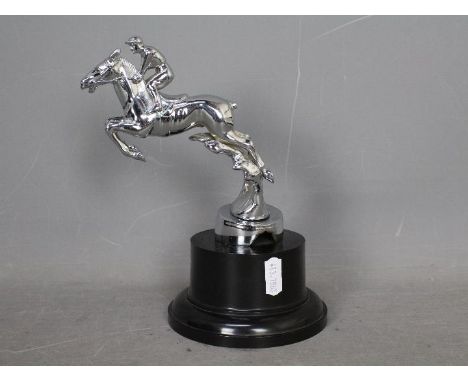 Automobilia - A Desmo car mascot in the form of a horse and jockey, chrome finish and mounted to a bakelite plinth, approxima