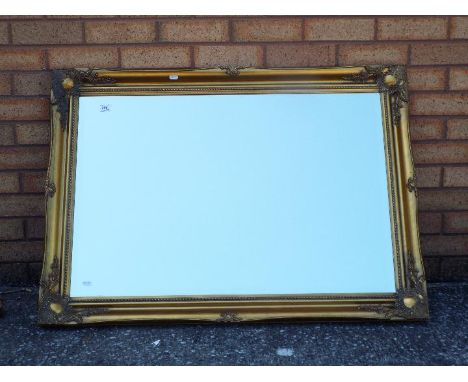 Large bevel edged mirror, approximately 75 cm x 105 cm.