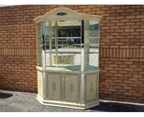 Eddi Rose Collection of Italy - a large canted, glazed display cabinet with shelved mirror backed interior, approx 217 cm (h)