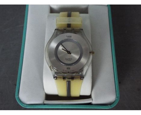 A gentleman's Swatch watch, boxed