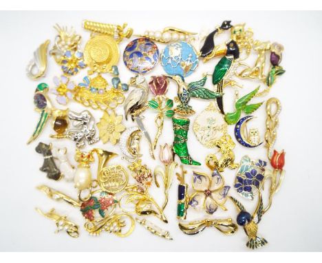 A good collection of modern, enamel and stone set brooches.