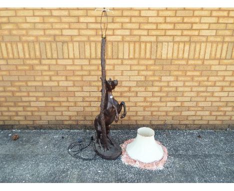 An unusual standard lamp, the base in the style of a rearing horseanext a tree trunk, with shade, approx 160 cm (h)