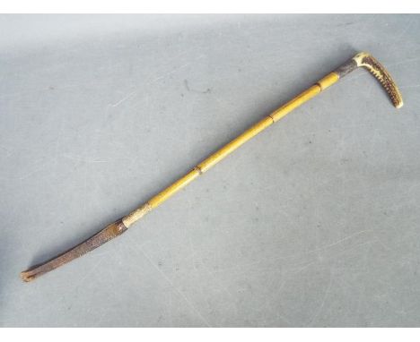 A late Victorian, antler handled hunting whip with silver collar hallmarked for Birmingham 1897