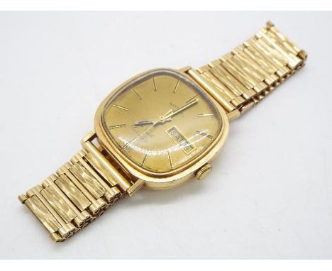 A gentleman's 9ct gold cased Rotary wristwatch on 9ct gold bark effect strap, approximately 50 grams all in.