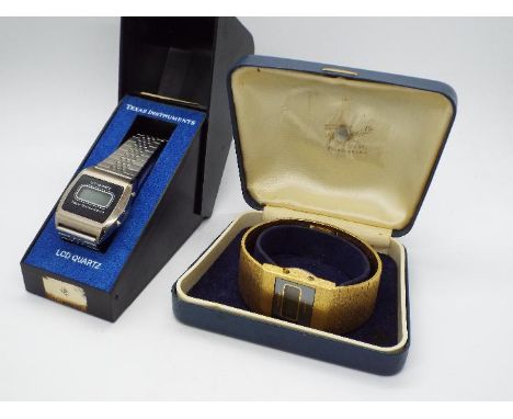 Two vintage digital watches comprising a gold plated Rotary and a stainless steel Texas Instruments example, both boxed. [2]