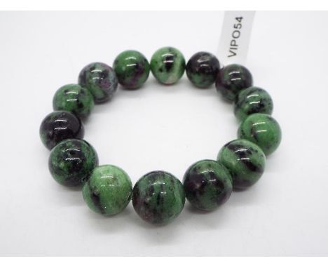 A 307 ct Ruby-Zoisite elastic bracelet issued in a limited edition 1 of 150, stone size 14 mm x 14 mm with presentation pouch