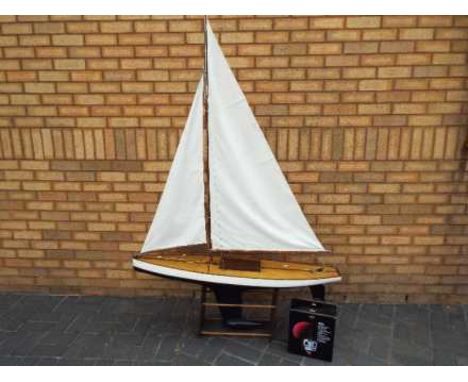 A radio controlled plank built pond yacht. The wooden Marblehead plank built yacht was constructed in 1945 and was originally
