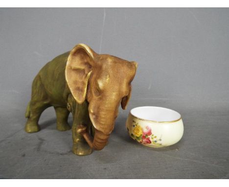 A small early 20th century Royal Worcester blush ivory bowl with floral decoration, 3.5 cm (h) and a Royal Dux elephant figur