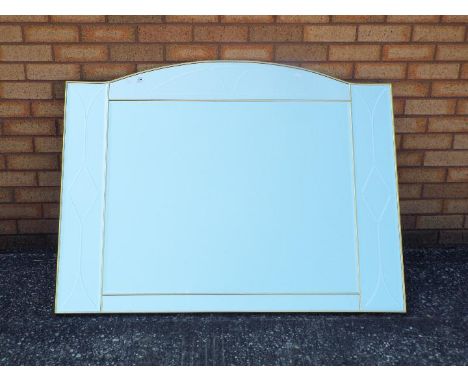 A large wall mirror measuring approximately 100 cm x 130 cm.