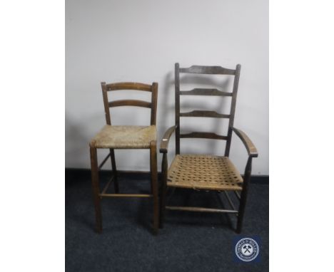 A rush seated ladder back armchair and a stool 