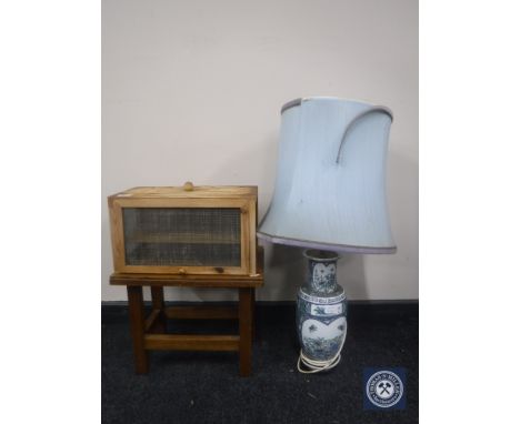 A china table lamp with shade, small wooden stool and a cheese safe 