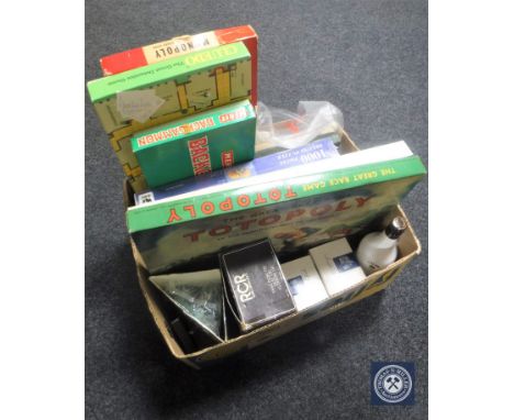 A box of vintage board games, jig saws, bottle of Malibu, two boxed Spode mugs, boxed crystal vase 