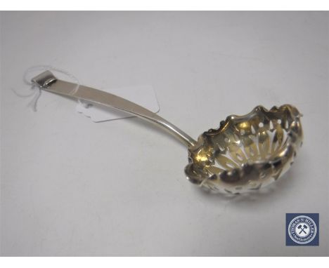 A silver caddy spoon