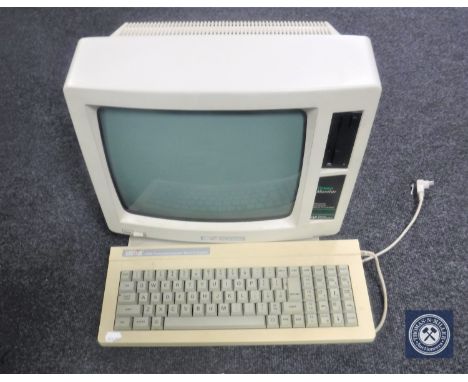 A vintage Amstrad personal computer word processor with keyboard
