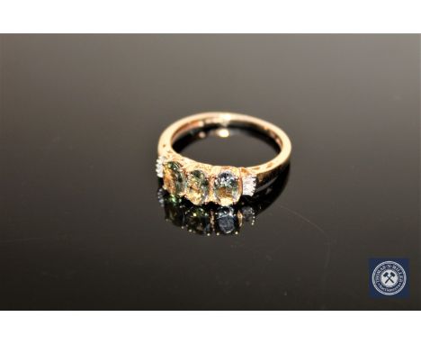 A 9ct gold green tanzanite and CZ ring, size O/P CONDITION REPORT: 2.1g