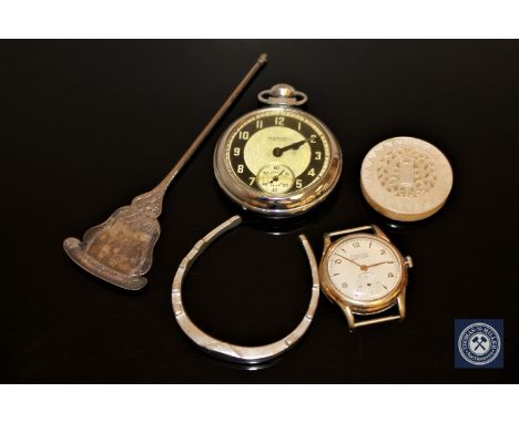 An Ingersoll pocket watch, gent's wristwatch signed Exactus, silver horseshoe, carved mother of pearl roundel and a white met