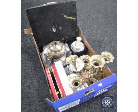 A box of seven-way plated epergne, teapot, Wedgwood table lighter, cased cutlery, boxed die cast car etc