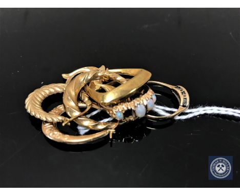 A small collection of 9ct gold to include two rings, two dolphin pendants, together with four assorted earrings.