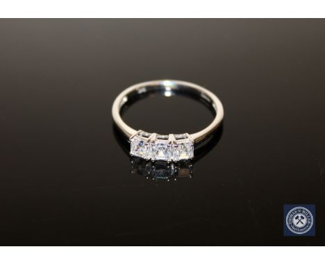 A 9ct white gold CZ three-stone ring, size U CONDITION REPORT: 2.3g