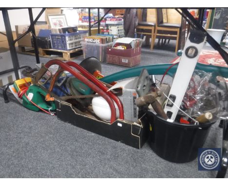 A large quantity of hand tools, hardware, bow saws, two electric strimmers and hedge trimmer 